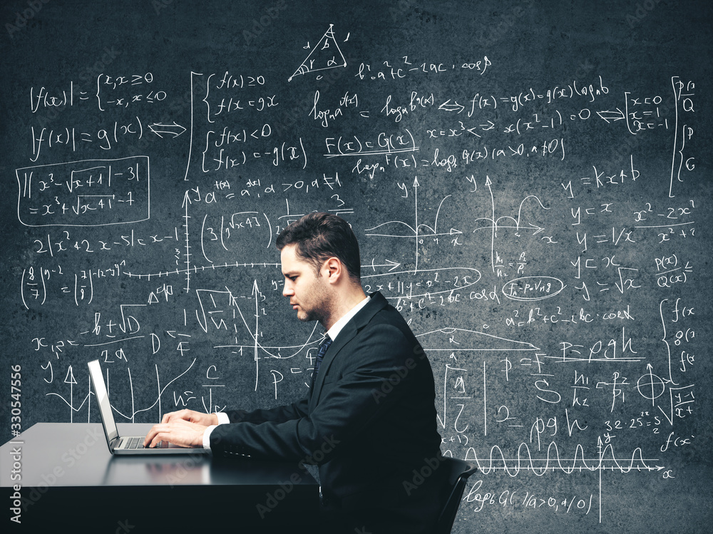 Businessman sitting in office and using laptop Businessman sitting in office and using laptop
