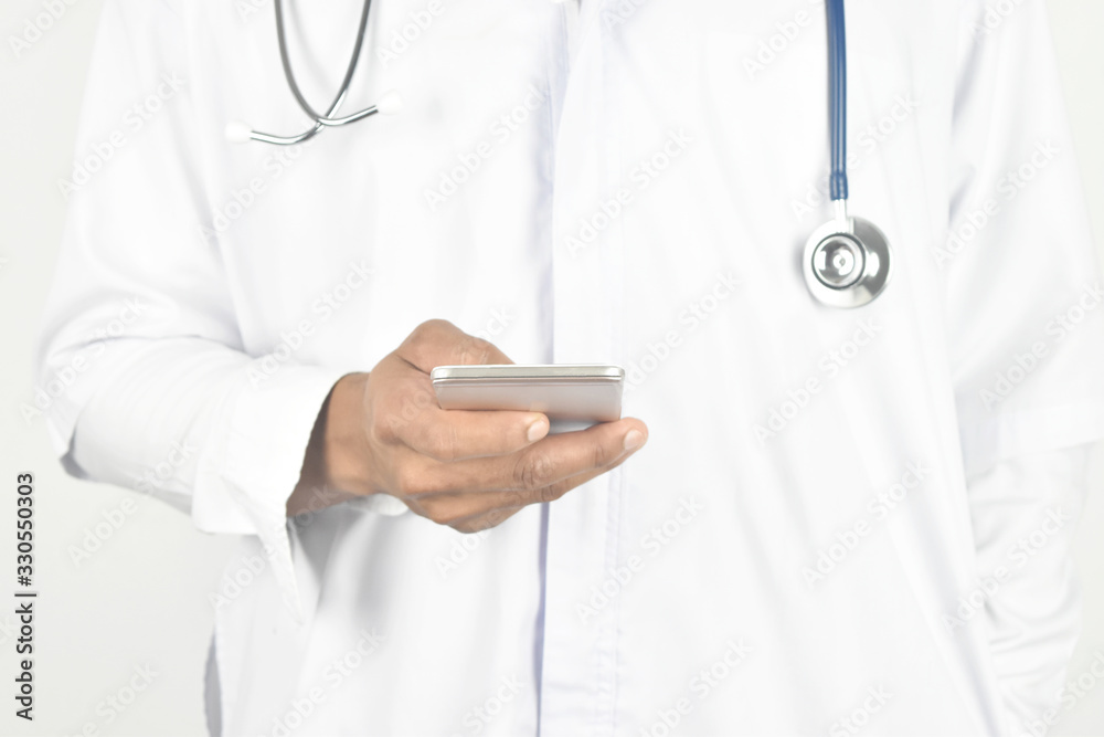 doctor holding mobile phone on white.