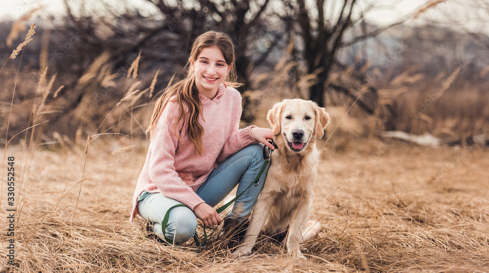 Beautiful girl with dog outside