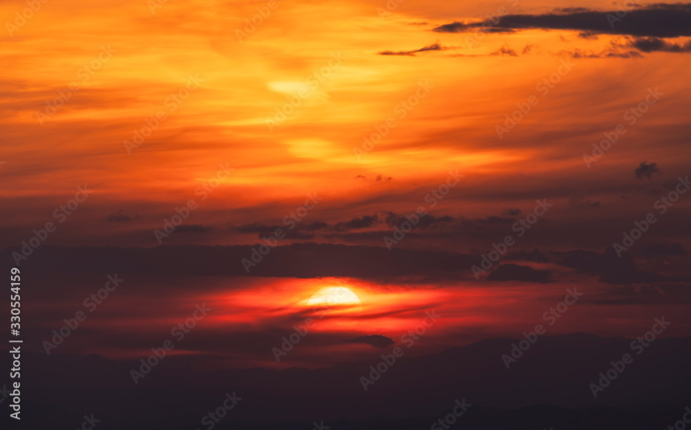Beautiful colorful bright sunset sky with orange clouds. Nature sky background. 