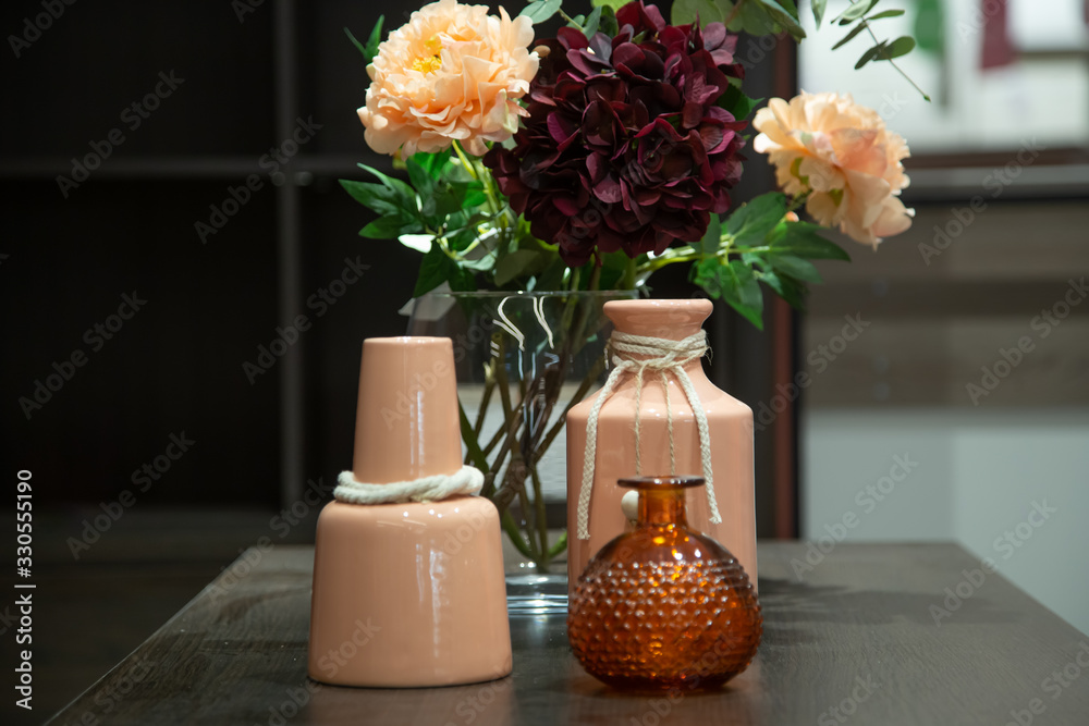 Decorative items in the interior, a Beautiful vase on the table. - obrazy, fototapety, plakaty 