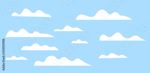 Cloud set. Cartoon white clouds on blue sky. Stylized Design elements collection