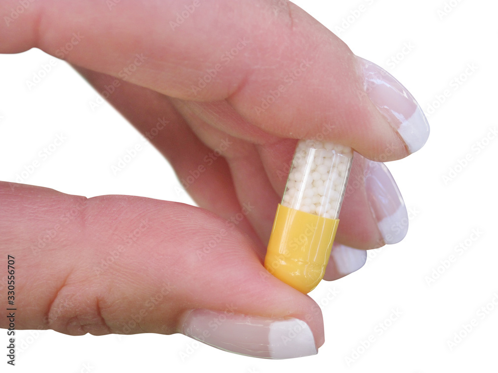 Hand with tablets isolated on black with clipping path Hand with tablets isolated on black with clipping path
