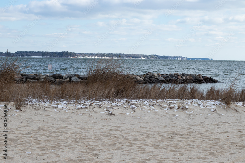 Snow patches along the beach of the riverfront in Yorktown, Virginia, by the inland beach. Snow patches along the beach of the riverfront in Yorktown, Virginia, by the inland beach.