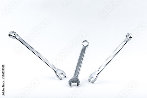 three wrenches levitating on white background. levitating spanners isolated on white background