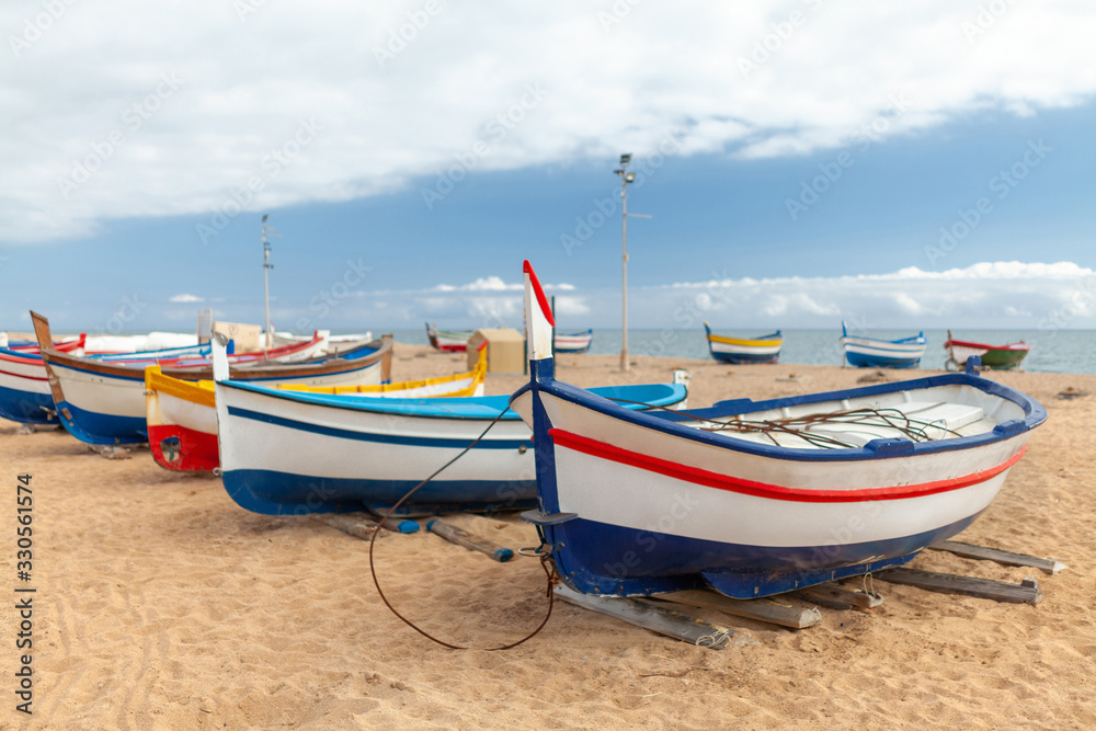 fishing boats by the sea on a sunny day