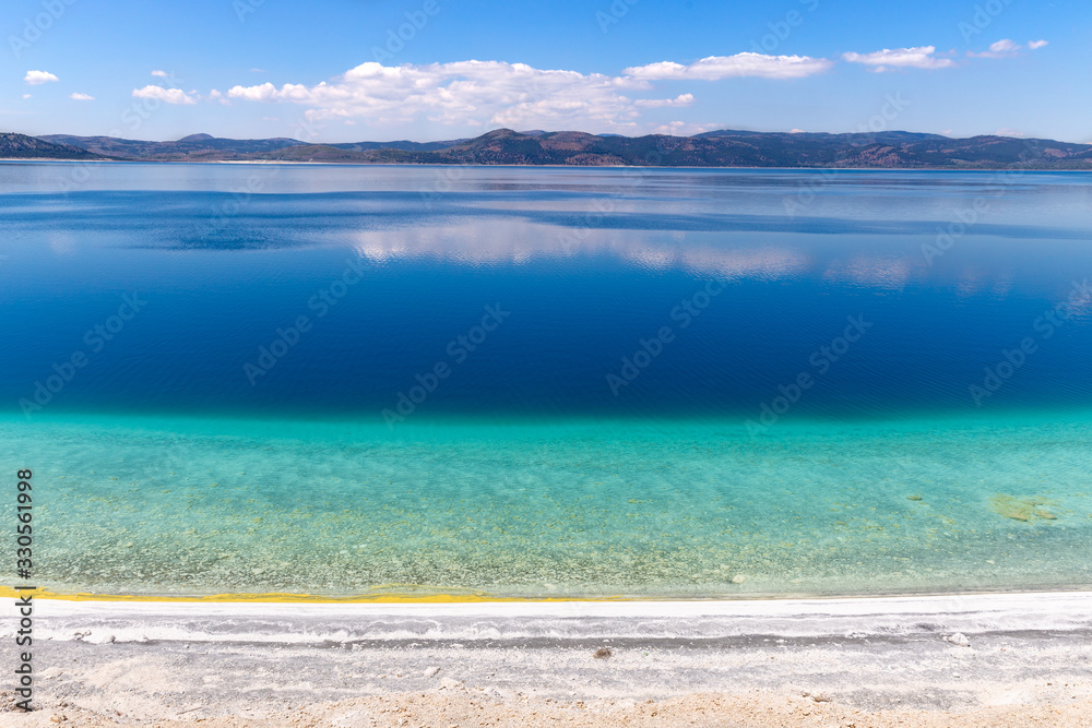 View from the Lake Salda. Lake Salda is a mid-size crater lake in southwestern Turkey, within the boundaries of Yesilova district of Burdur Province.