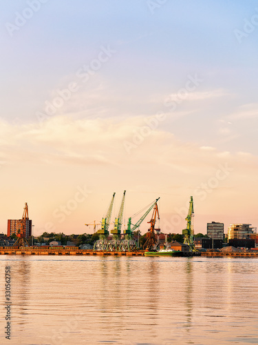 Loading cranes and ship in Baltic sea in Klaipeda