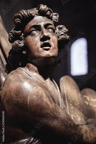 Wooden Evangelist Statue as a Pulpit decoration inside a church in Grimbergen Belgium by Flemish sculptor Hendrik Frans Verbruggen (1654-1724) photo