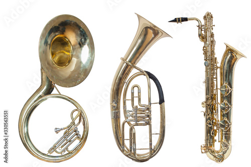 set of three wind musical instruments, classic wind instrument sousaphone, classic wind musical instrument saxophone and baritone Euphonium, isolated on a white background photo