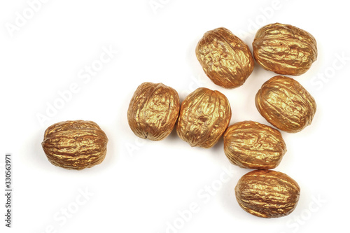 Golden walnuts on a white background