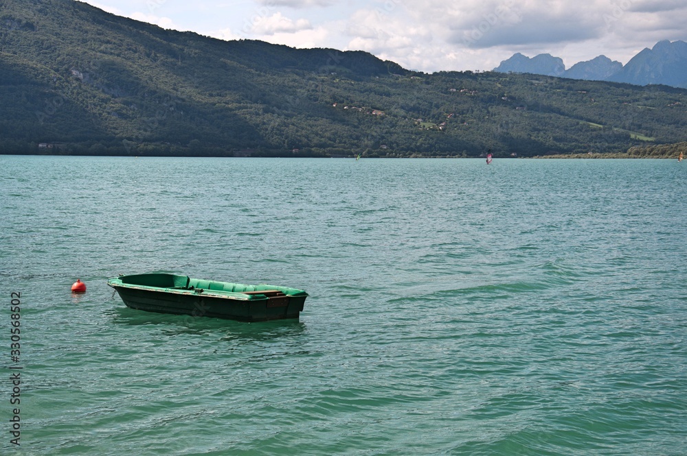 Stationary boats on the lake of santa croce