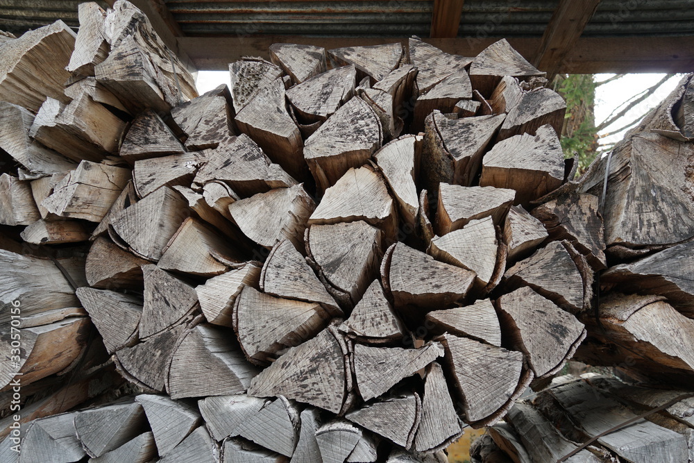 pack of logs or billets for heating in diagonal view in deposit for winter heating wood. pack of logs or billets for heating in diagonal view in deposit for winter heating wood.