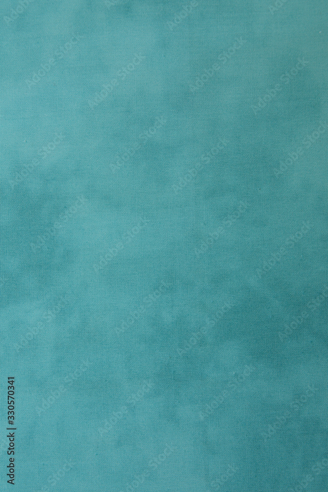  turquoise or aqua menthe blue marble fabric background with space for text or image. Pattern, texture, background. Vertical photo.
