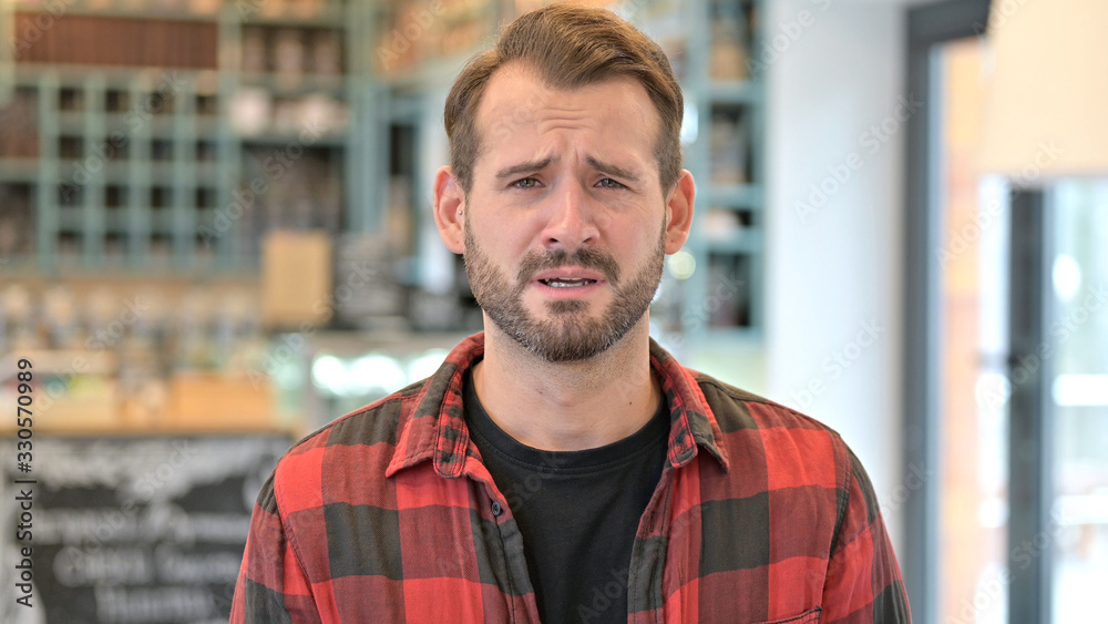 Upset Beard Young Man Looking at Camera Upset Beard Young Man Looking at Camera