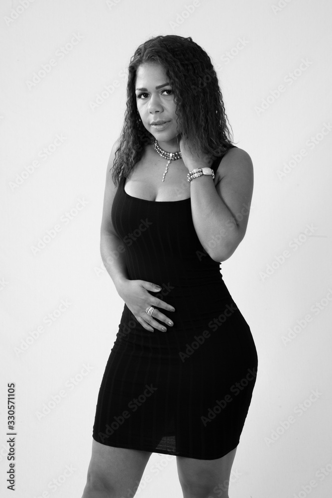 Thoughtful Hispanic woman in black and white Thoughtful Hispanic woman in black and white