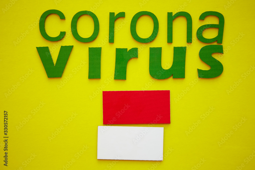 Flag of Monaco And Word CORONAVIRUS made of green cardboard letters, isolated on yellow background. World Health Organization WHO introduced new official name for Coronavirus disease named COVID-19 Flag of Monaco And Word CORONAVIRUS made of green cardboard letters, isolated on yellow background. World Health Organization WHO introduced new official name for Coronavirus disease named COVID-19