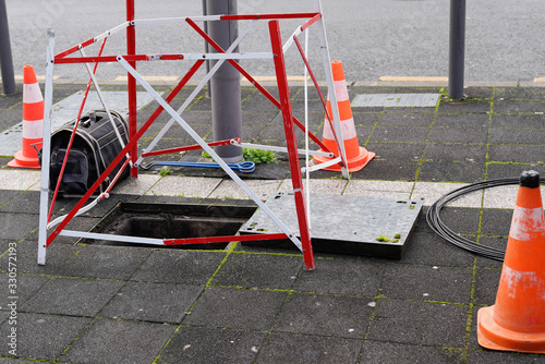 Work Fibre optic cable in city street digital Fiber Internet connection cables crossing