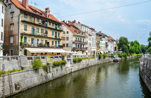 View on Ljubljanica river with old buildings in the historical center of Ljubljana. Ljubljana is the capital of Slovenia and famous european tourist destination.