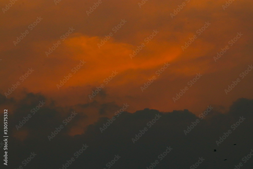sunset sky with red and orange clouds