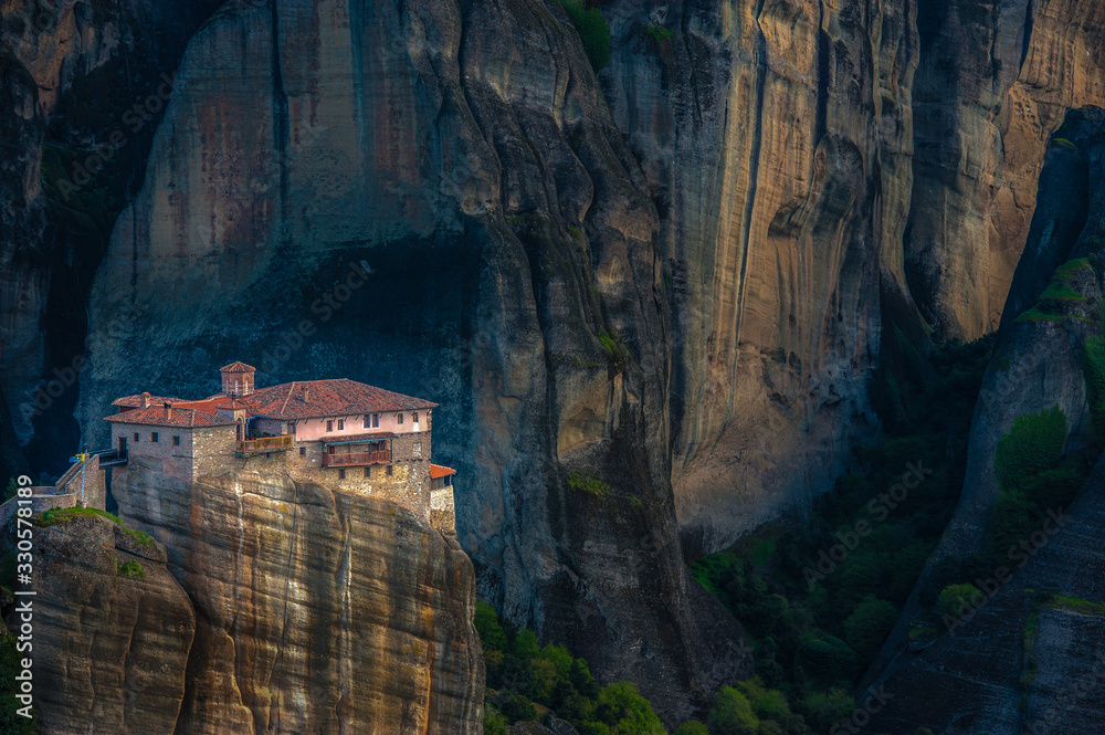 GRECE, METEORA, Like a bird's nest monastery Roussanou sits on a sheer cliffs of Meteora in Northern Greece