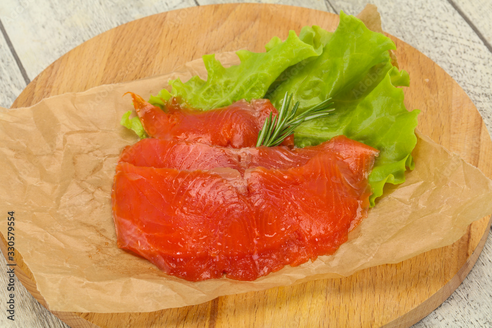 Sliced salmon fillet served rosemary Sliced salmon fillet served rosemary