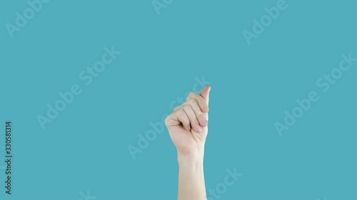 Male hand with snapping fingers on blue screen background. Chromakey
