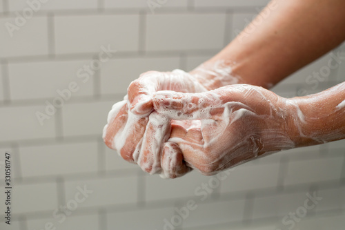 A man washing hands with soap. Preventing spreading virus concept.