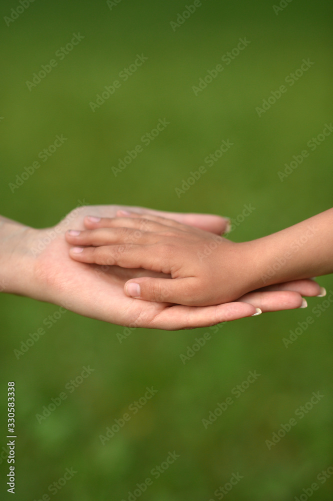 daughter and mother holding hands close up daughter and mother holding hands close up
