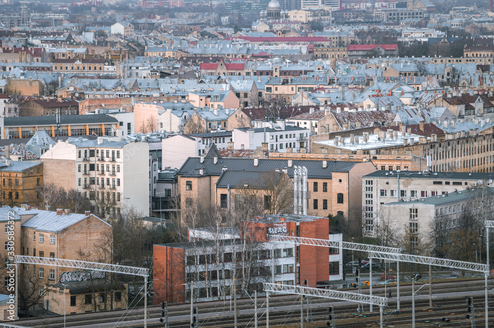 Panoramic, aerial view over Riga city. Scenic view over iconic church towers, old town and infrastructure.