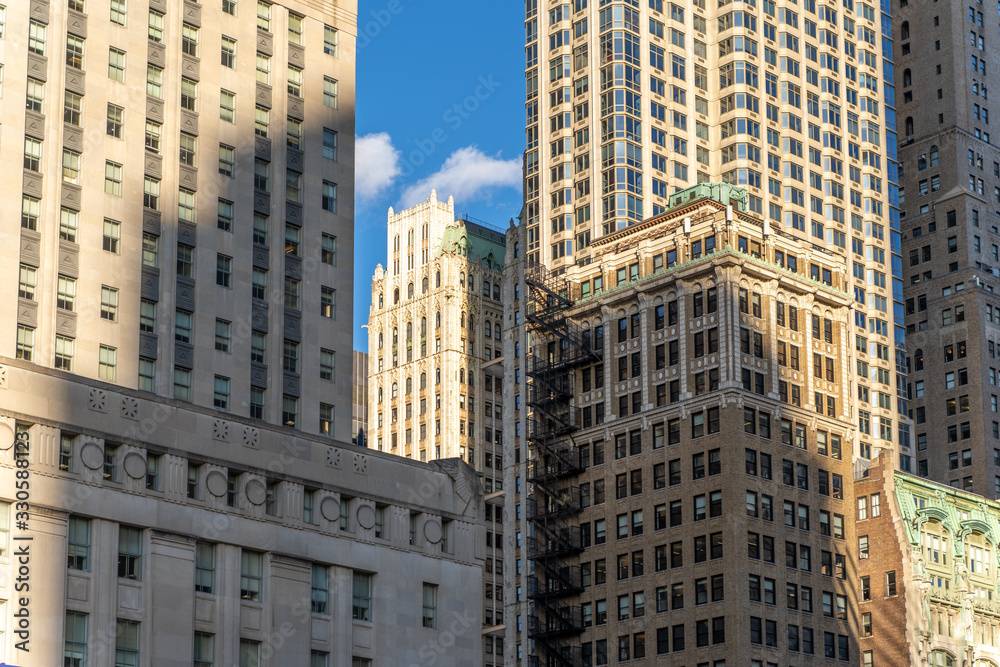 Shadow of a modern skyscraper on historic buildings, new york city NYC manhattan