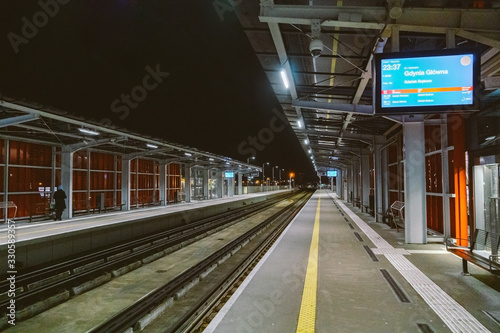 Train station at Gdansk airport GDN in Poland. railway platform of Lech Walesa Airport in Gdansk, Poland. Gdansk Airport lotnisko train station. Platform of Pomeranian Metropolitan Railway at night