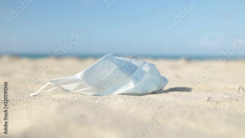 medical mask for coronavirus protection on the beach in a tropical country photo