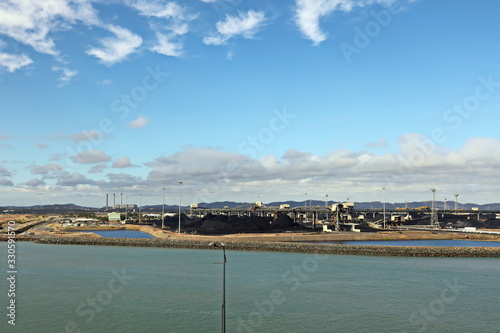 Cargo terminal for loading coal cargos by shore cranes. Port Gladstone, Australia. December, 2019. photo