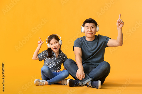 Happy Asian man and his lit...