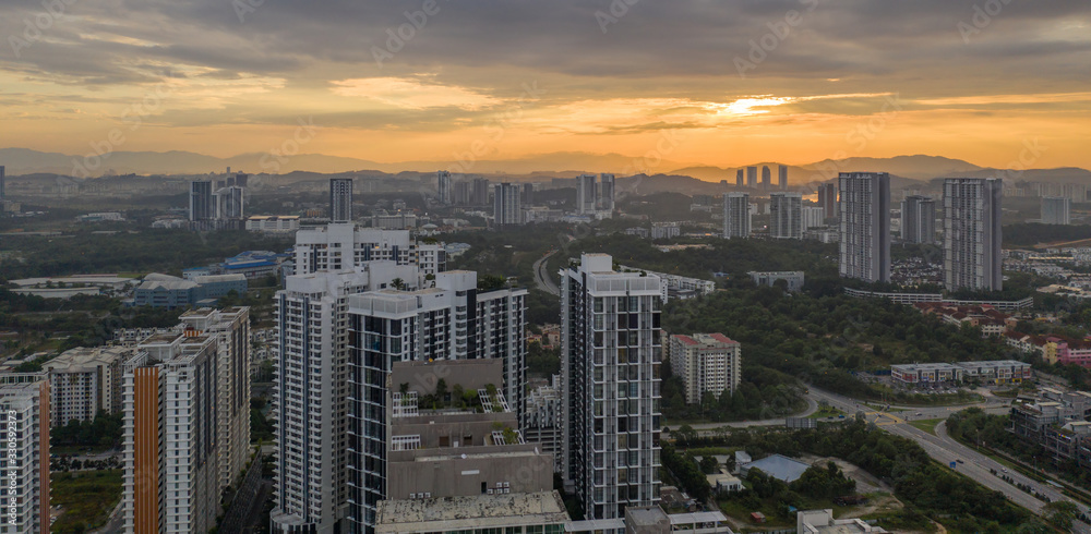 Fototapeta premium Aerial view of apartment buildings in Cyberjaya City, Malaysia at sunrise.