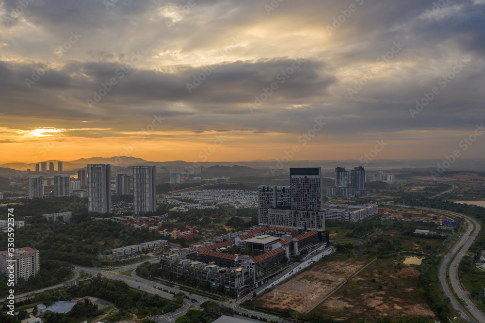 Obraz premium Aerial view of apartment buildings in Cyberjaya City, Malaysia at sunrise.