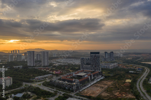 Aerial view of apartment buildings in Cyberjaya City, Malaysia at sunrise.