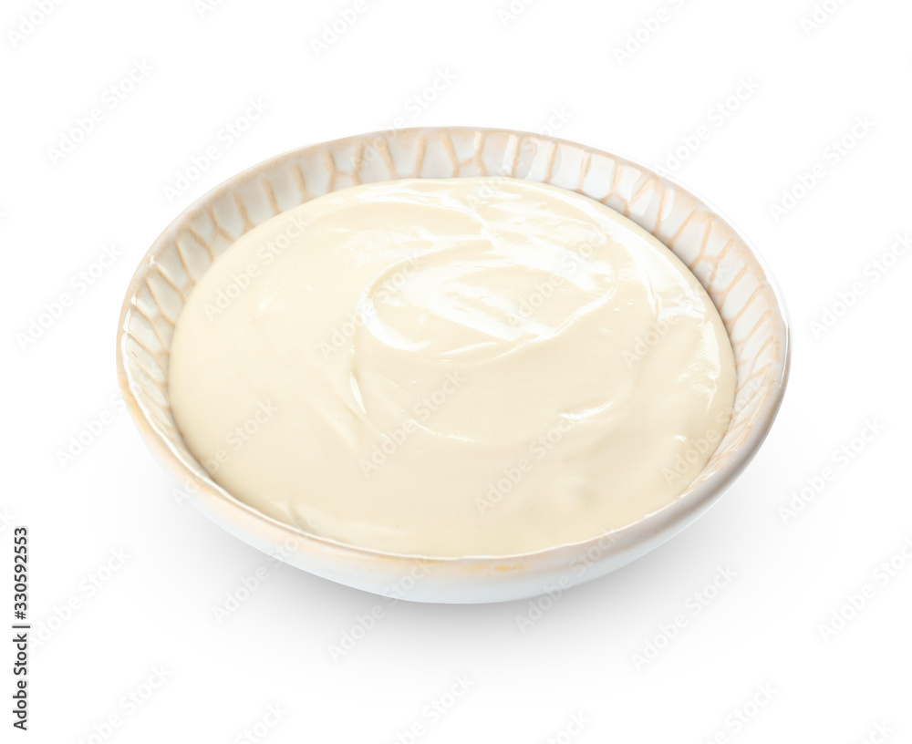 Bowl with tasty cream cheese on white background Bowl with tasty cream cheese on white background
