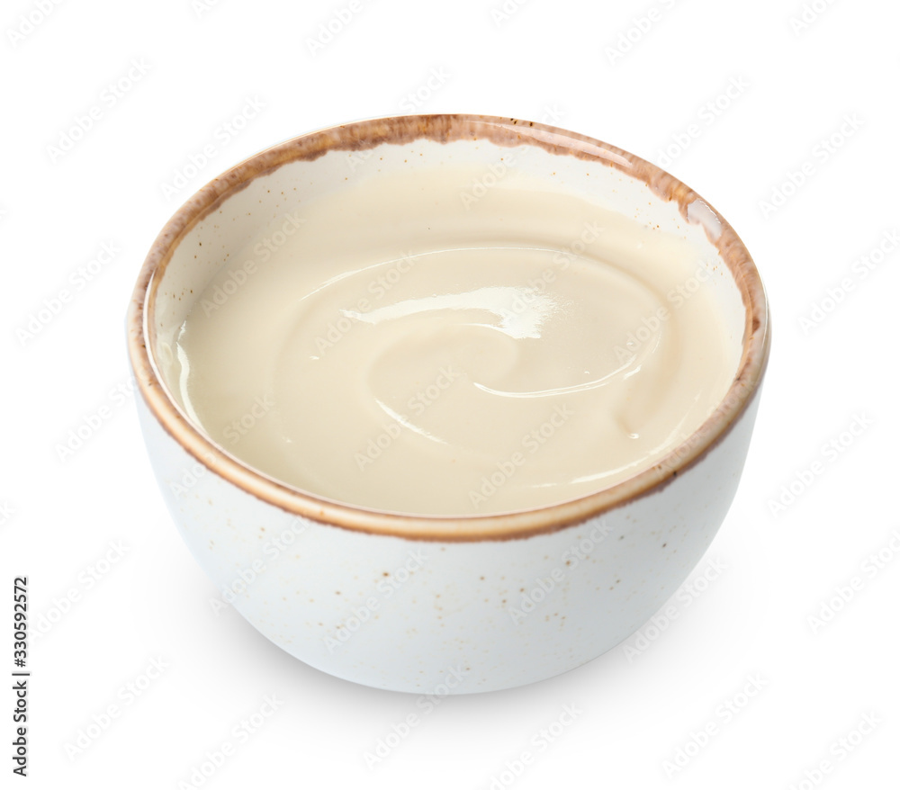 Bowl with tasty cream cheese on white background Bowl with tasty cream cheese on white background