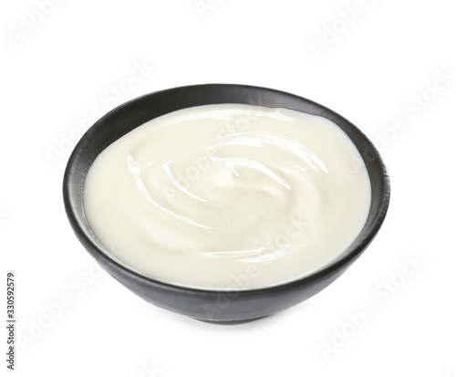 Bowl with tasty cream cheese on white background