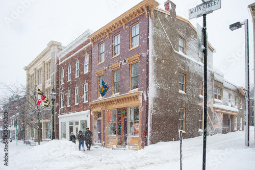 Annapolis street scene of shops during blizzard with snow falling heavily