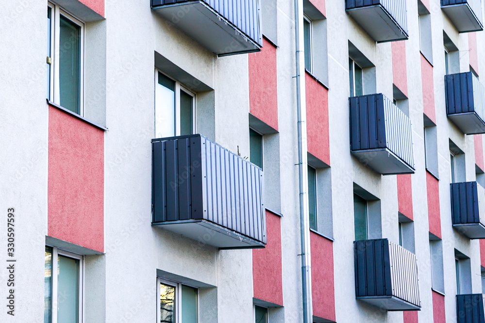 colorful renovated and thermally insulated apartment house facade