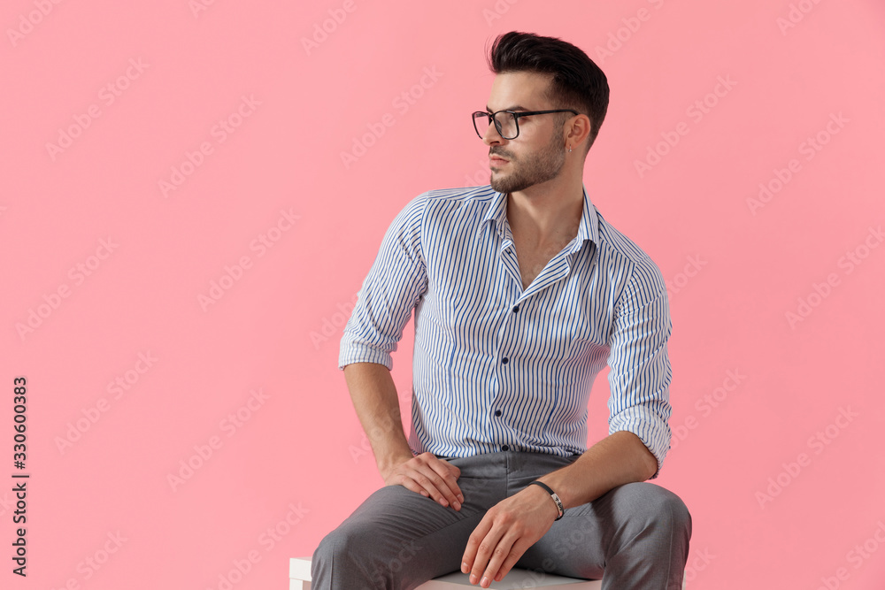 Dreaming smart casual man looking away while wearing glasses Dreaming smart casual man looking away while wearing glasses