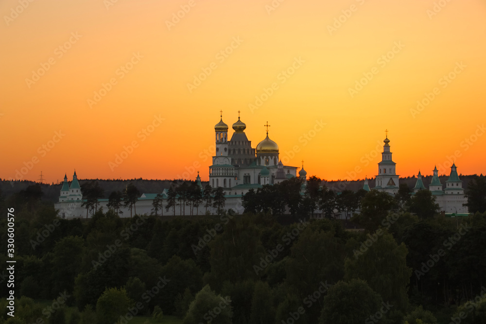 Resurrection New Jerusalem Monastery on a sunset background in the Moscow region, Russia