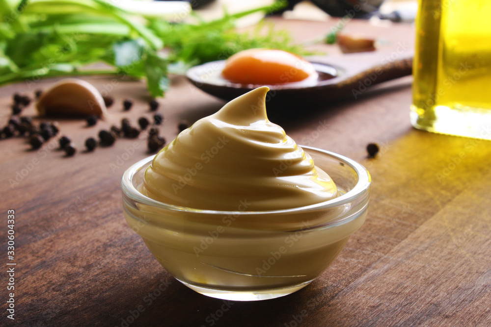 mayonnaise sauce on a wooden background cooking mayonnaise sauce on a wooden background cooking