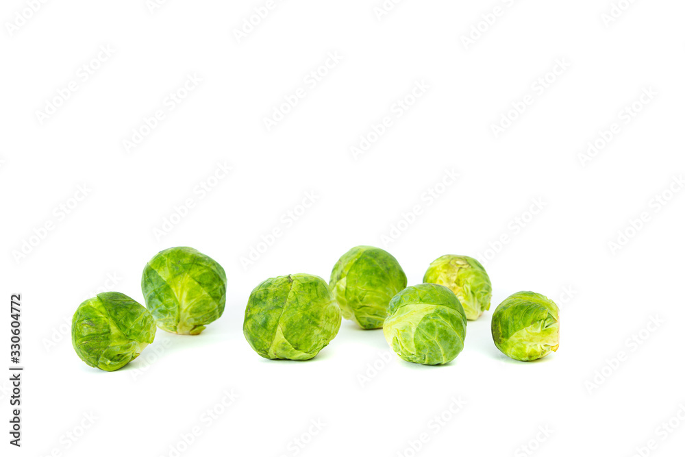 Brussels sprouts on a white, isolated background. The concept of food and cooking. Eating vegetables and healthy nutrition. Eating Brussels sprouts, adding to dishes. Brussels sprouts on a white, isolated background. The concept of food and cooking. Eating vegetables and healthy nutrition. Eating Brussels sprouts, adding to dishes.