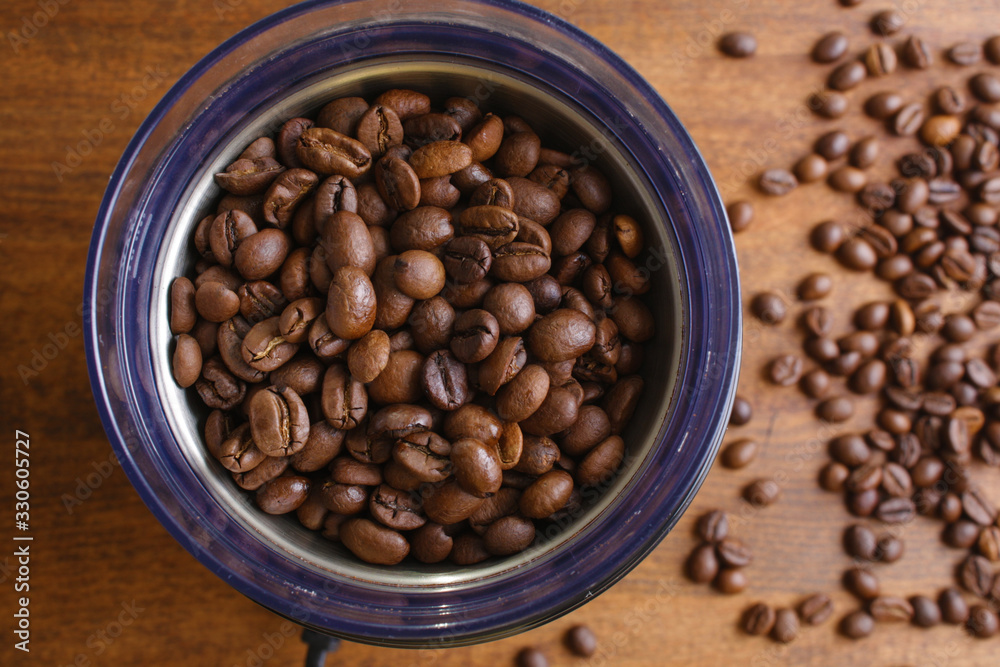 coffee beans in an electric coffee grinder coffee beans in an electric coffee grinder