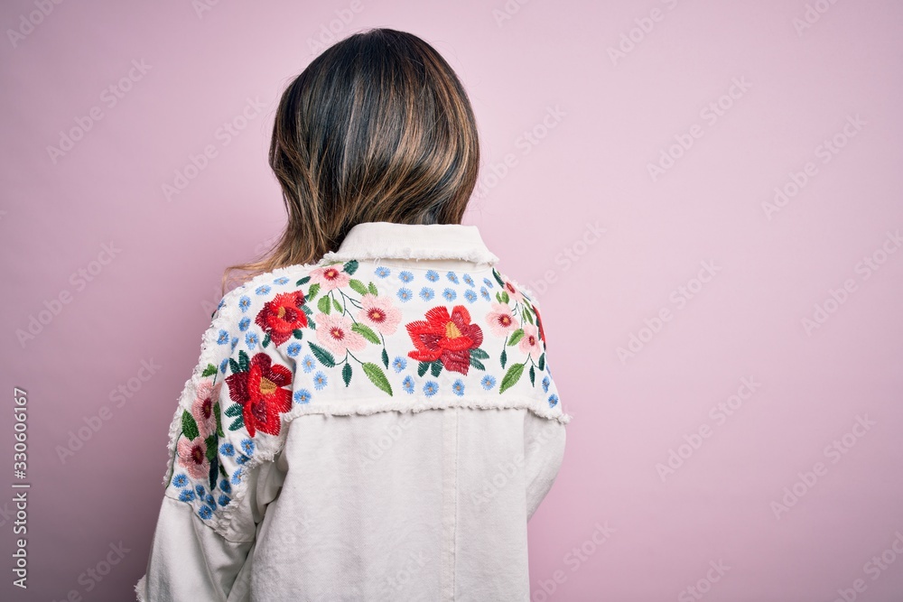 Young beautiful woman wearing fashion urban clothes, model wearing casual street style standing over pink background Young beautiful woman wearing fashion urban clothes, model wearing casual street style standing over pink background