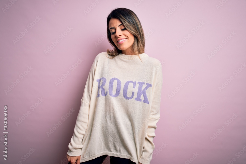 Young beautiful woman wearing fashion urban clothes, model wearing casual street style standing over pink background Young beautiful woman wearing fashion urban clothes, model wearing casual street style standing over pink background